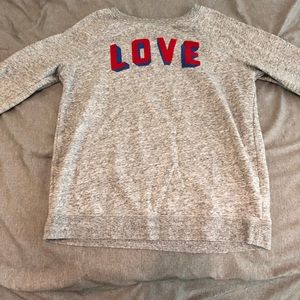 Grey sweater that says “love”